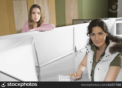 Portrait of two young women in a computer lab