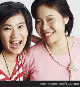 Portrait of two young women looking cheerful