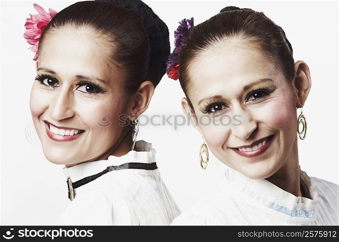 Portrait of two young women posing and smiling