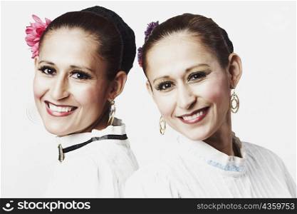 Portrait of two young women posing and smiling