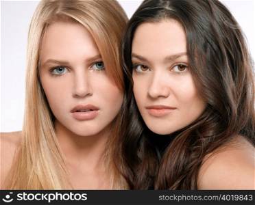 Portrait of two young women side by side