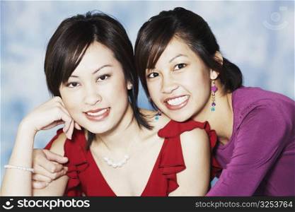 Portrait of two young women smiling