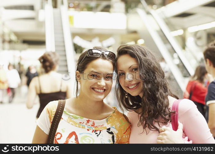 Portrait of two young women smiling