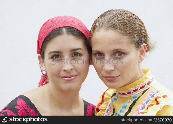 Portrait of two young women smiling together