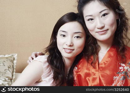 Portrait of two young women smiling together