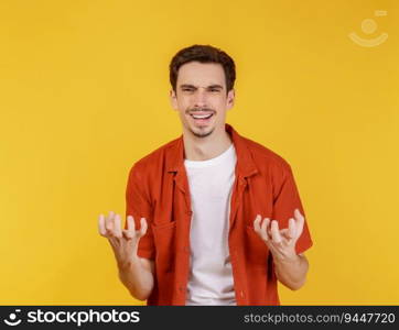 Portrait of unhappy and frustrated man on isolated yellow background. People and emotion concept.