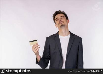 Portrait of unhappy businessman showing credit card isolated over white background. Online shopping, ecommerce, internet banking, spending money concept.