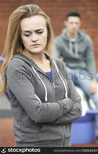Portrait Of Unhappy Teenage Couple In Urban Setting