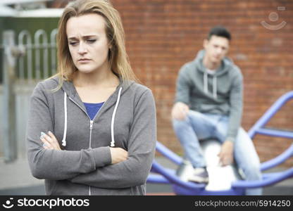 Portrait Of Unhappy Teenage Couple In Urban Setting