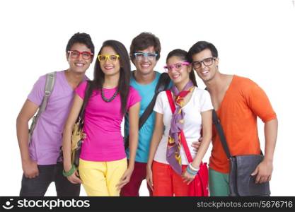 Portrait of university friends wearing colorful glasses on white background