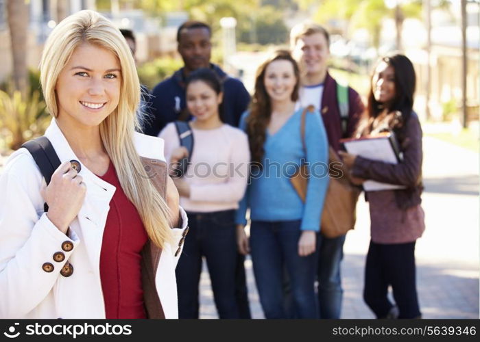 Portrait Of University Students Outdoors On Campus