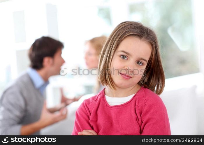 Portrait of upset child with parentt&acute;s fighting