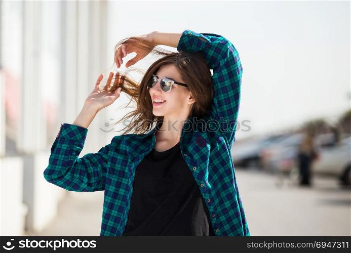 Portrait of urban fashionable girl posing outdoors in the city. Portrait of urban fashionable girl posing outdoors in the city.