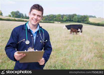 Portrait Of Vet In Field With Cattle In Background