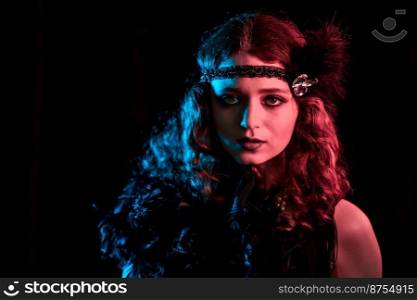 Portrait of vintage styled red haired woman dressed in Great Gatsby era flirting and posing on velours background. Roaring twenties, retro, party, fashion concept. High quality photo. Portrait of vintage styled red haired woman dressed in Great Gatsby era flirting and posing on velours background. Roaring twenties, retro, party, fashion concept