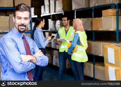 Portrait of White caucasian warehouse owner crossed arm with his worker meeting background in warehouse distribution center environment. Business acquisition and partnership warehouse concept.