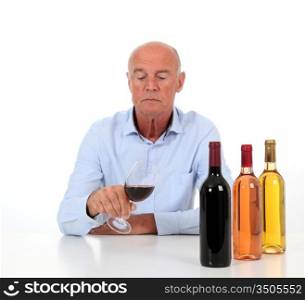 Portrait of winemaker tasting wine