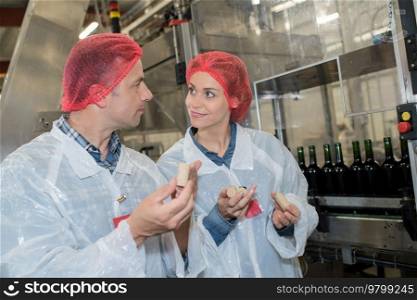 portrait of winemakers in lab coat