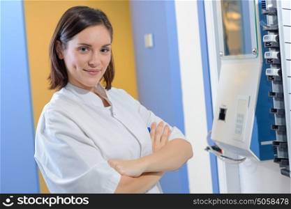 Portrait of woman at clocking in machine