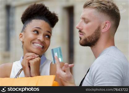 portrait of woman begging for boyfriends credit card