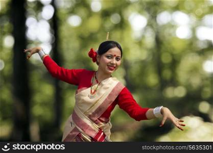 Portrait of woman doing Bihu dance