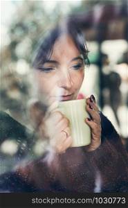 Portrait of woman drinking a coffee. Real people, authentic situations