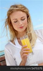 Portrait of woman drinking tropical juice
