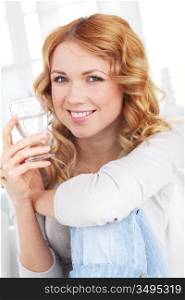 Portrait of woman drinking water