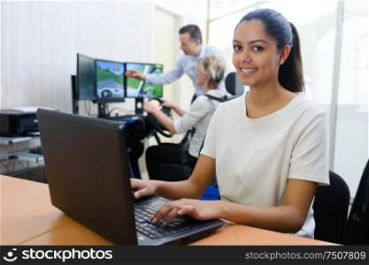 portrait of woman during computer simulated driving lesson