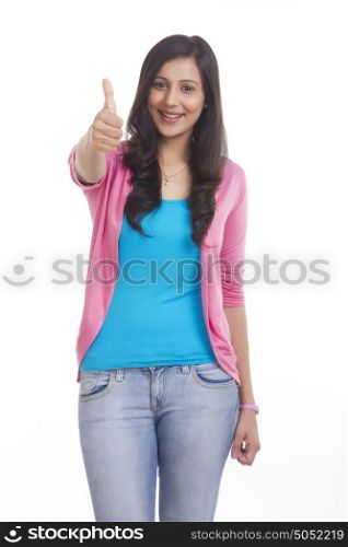Portrait of woman giving thumbs up