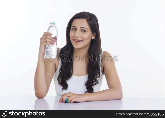Portrait of woman holding a water bottle