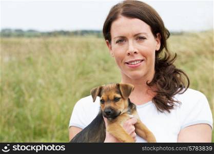 Portrait Of Woman Holding Pet Dog