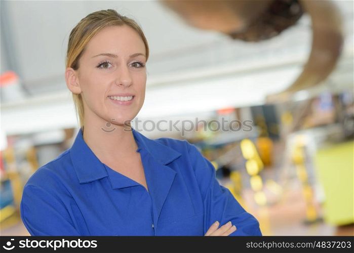 Portrait of woman in blue work jacket
