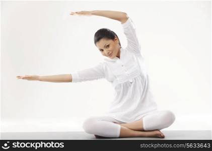 Portrait of woman in casual clothes practicing yoga