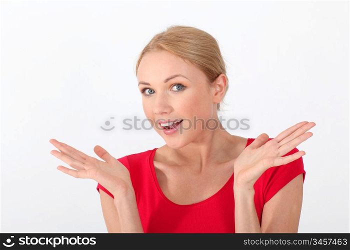 Portrait of woman in red shirt with surprised look