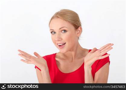 Portrait of woman in red shirt with surprised look