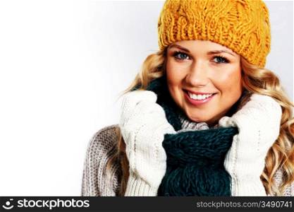 Portrait of woman on white background wearing woolen accessories