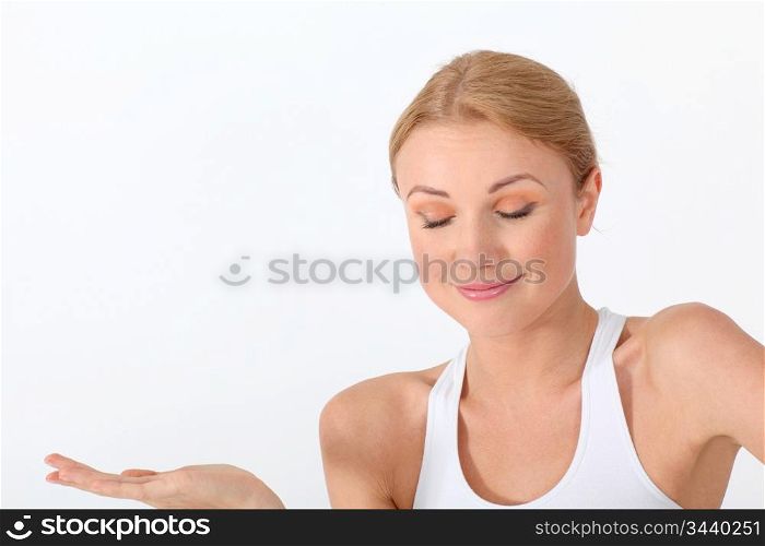 Portrait of woman on white background with eyes shut