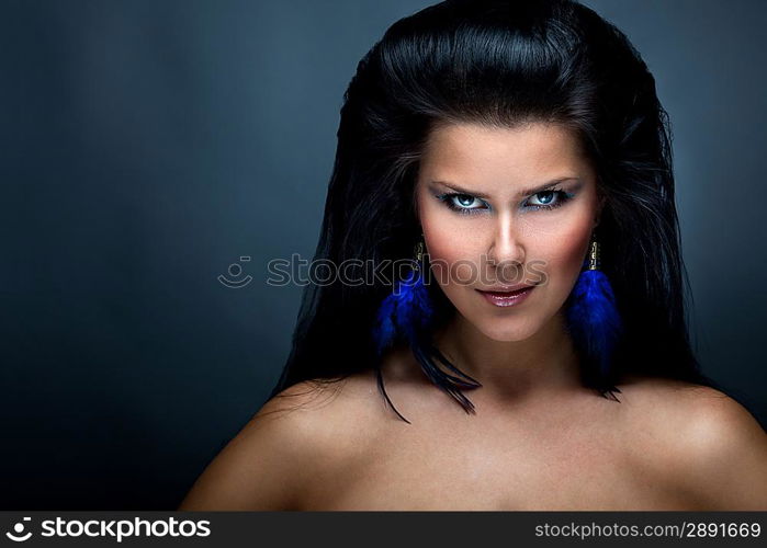 Portrait of woman over dark gray background