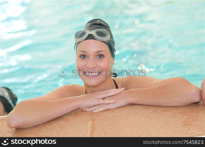 portrait of woman posing in the pool