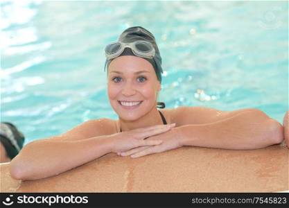 portrait of woman posing in the pool