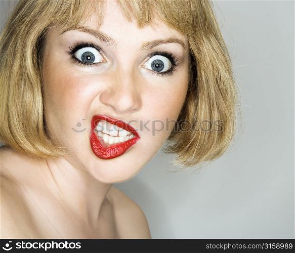 Portrait of woman pulling a funny face