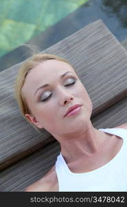 Portrait of woman relaxing in deck chair