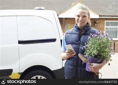 Portrait Of Woman Running Mobile Gardening Business Using Mobile Phone