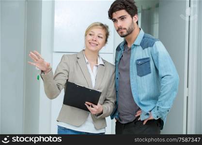 portrait of woman showing flat to student