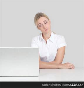 Portrait of woman sitting by laptop computer
