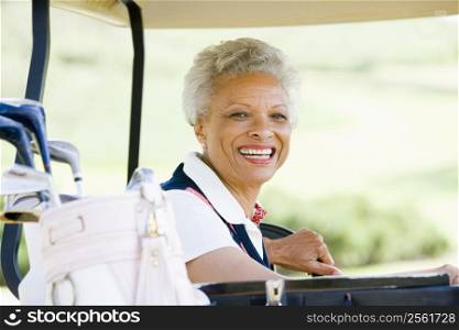 Portrait Of Woman Sitting In A Golf Cart