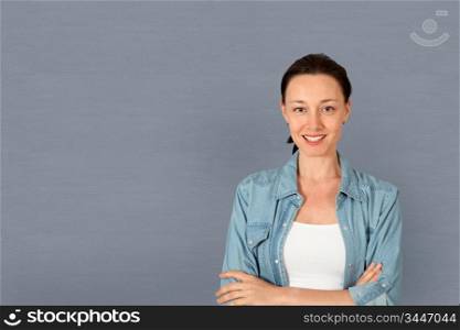 Portrait of woman standing on grey background