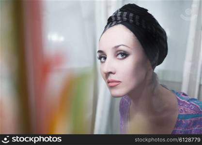 Portrait of woman wearing headscarf retro style
