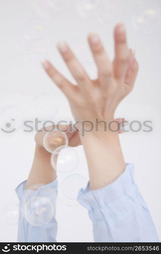 Portrait of woman with bubbles